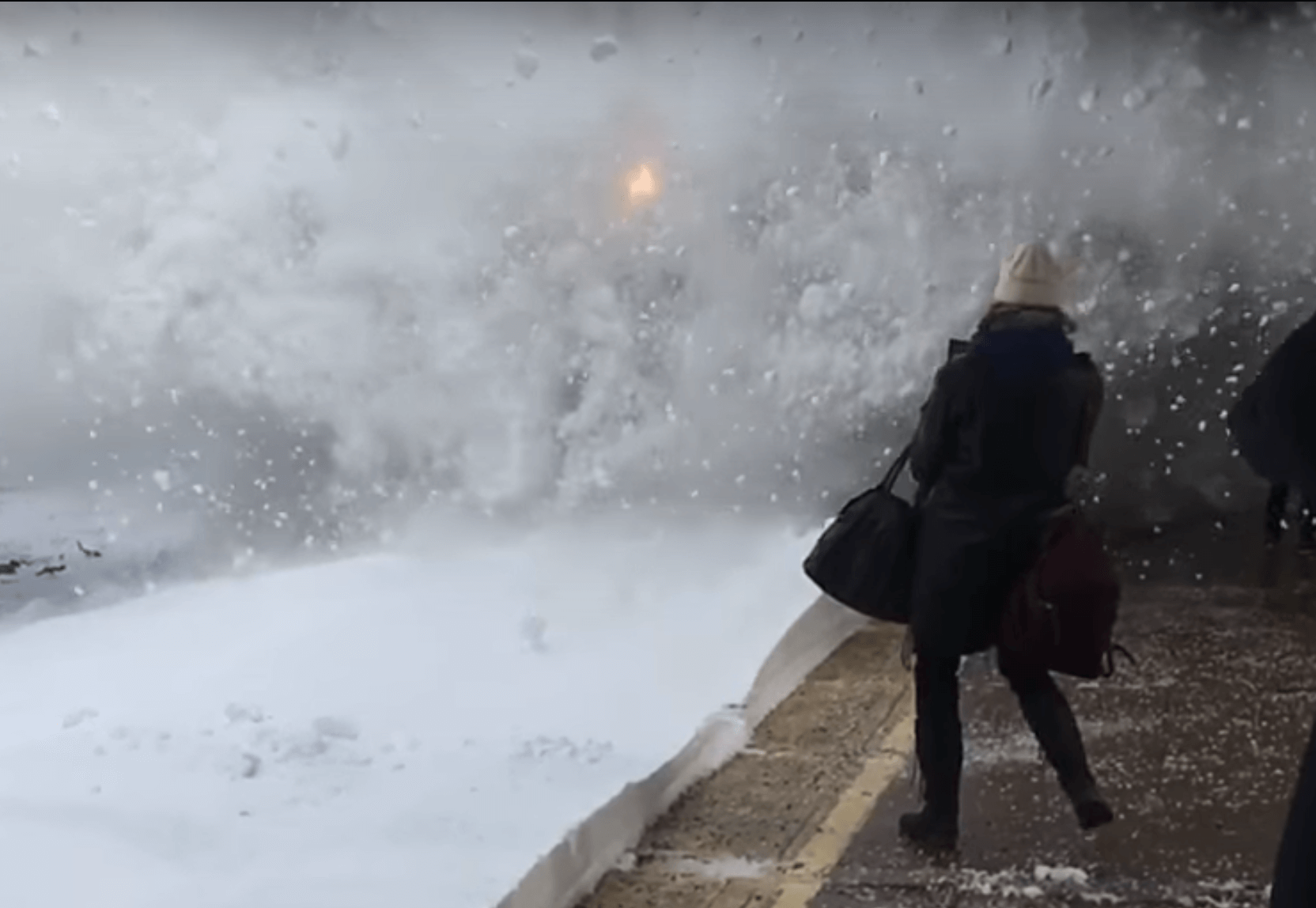 Amtrack train blasts commuters with snow